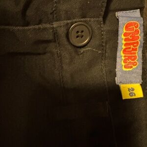 Black empire cargo pants with logo on front and back slightly worn